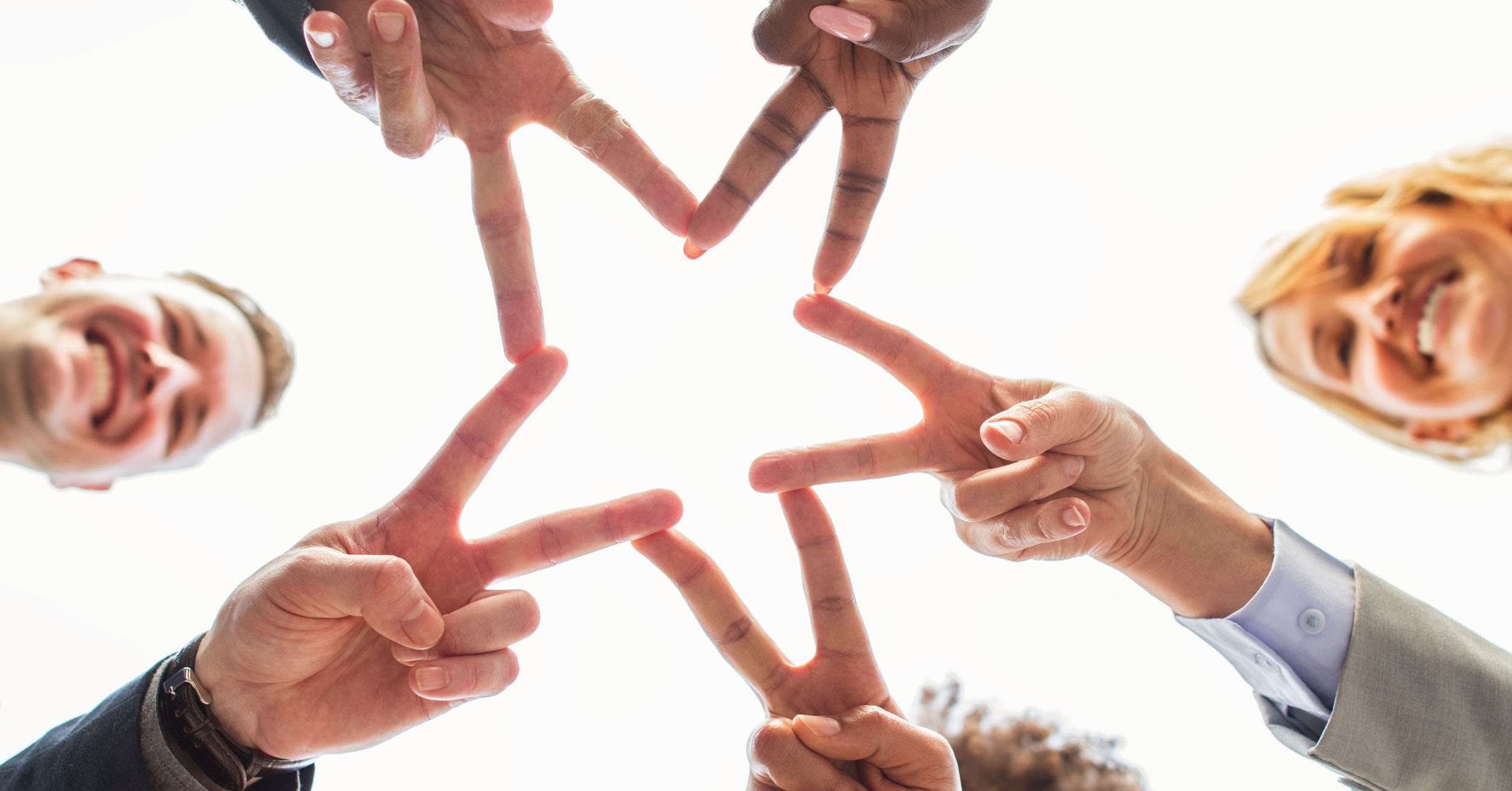 image header hands of a group of people shape of a star