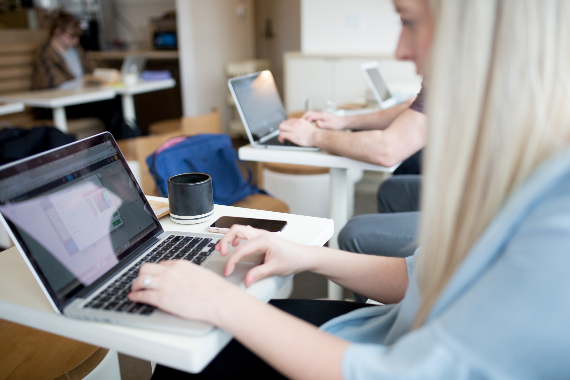 learner engaging in online training in front of laptop